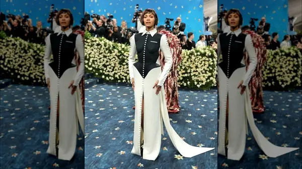 Zoe Saldana on the red carpet in a black and white gown