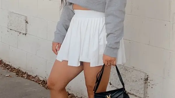 A woman in a traditional tennis skirt