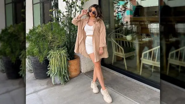 woman posing by building