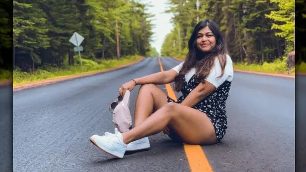 woman sitting in street