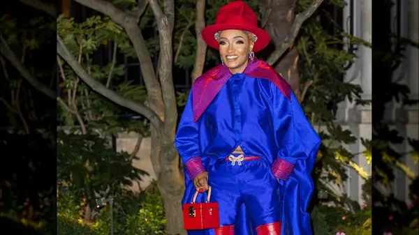 Woman in bright blue pantsuit