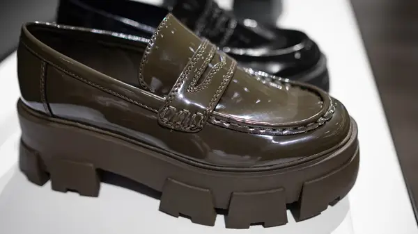 Brown and black platform loafers