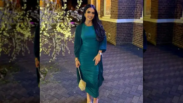 Wearing emerald dress