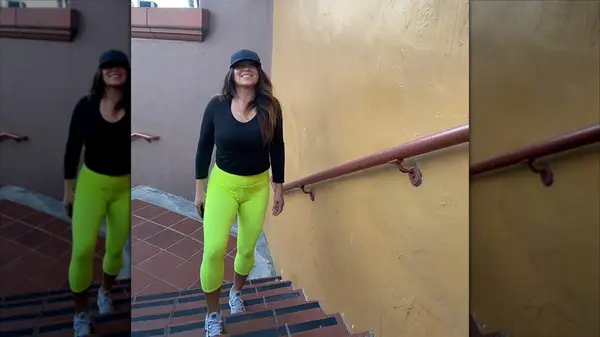 A woman in neon yellow leggings