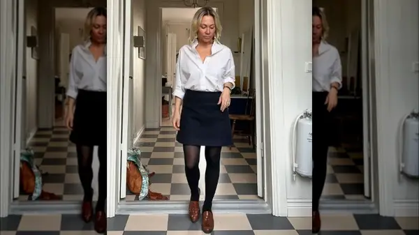 Woman wearing a skirt and loafers