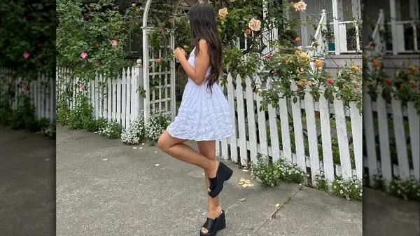 woman in white sundress and black sandals