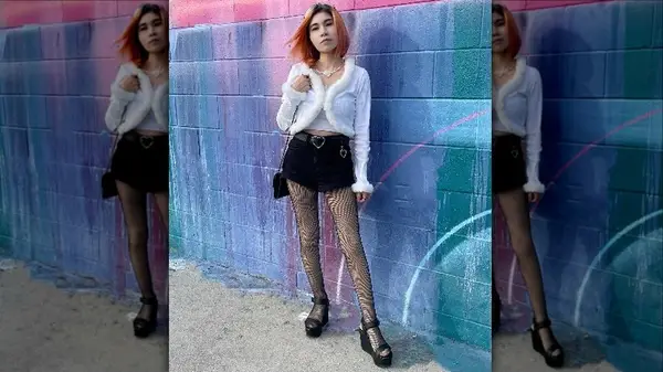 woman in white top and black shorts 