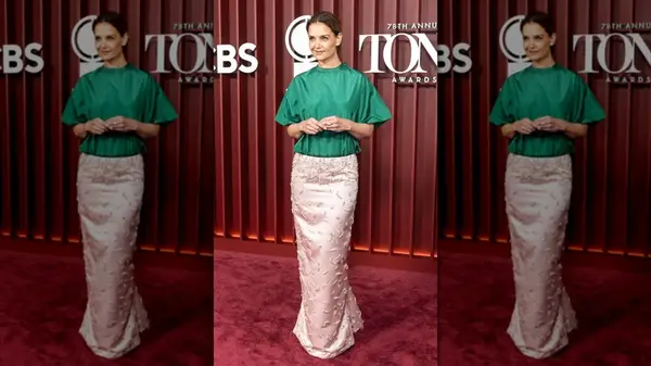 Katie Holmes on the red carpet in a pink skirt and green shirt