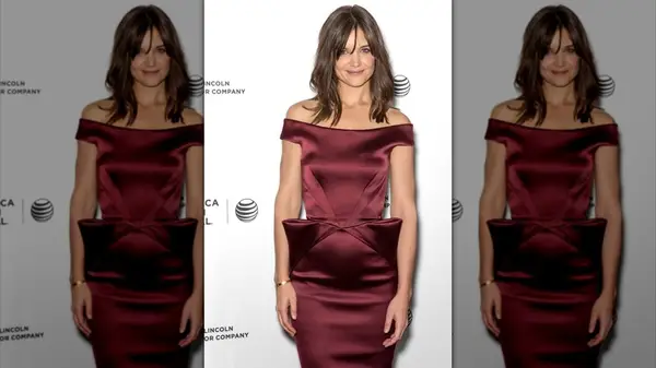 Katie Holmes on the red carpet in a burgundy dress