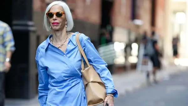 Woman in a blue dress and bag 