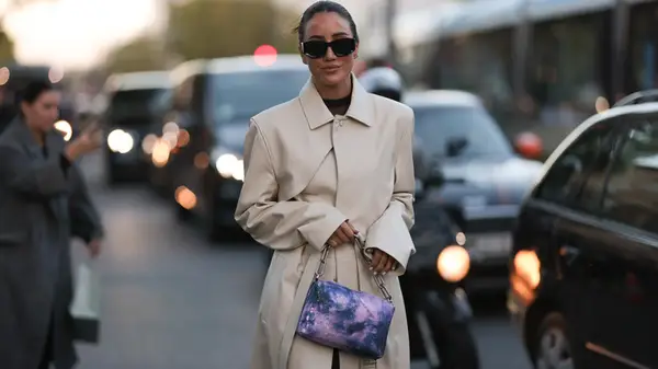 Woman carries tie-dye purse