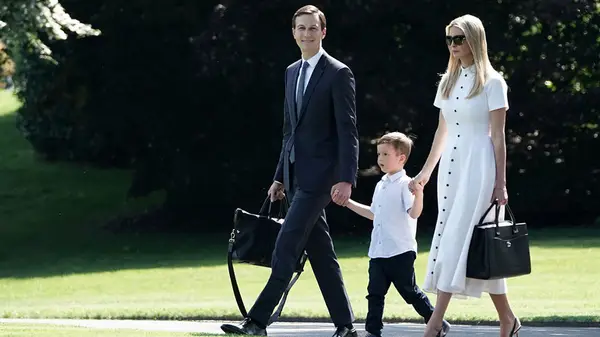 Ivanka Trump and Jared Kushner and their child at the White House