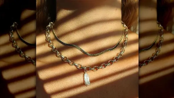 Two necklaces around a neck