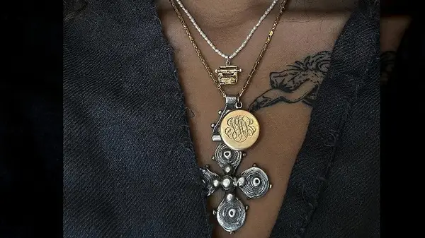 Mixed metal necklaces around a neck