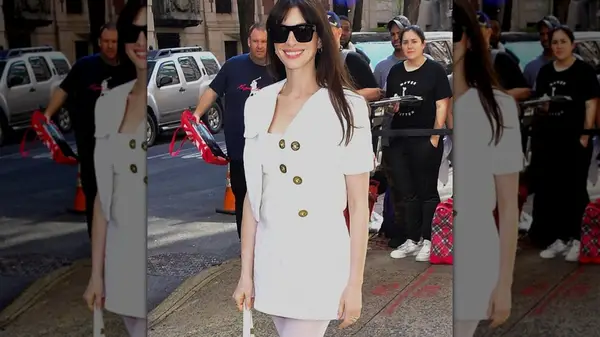 Anne Hathaway in a white dress and jacket