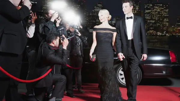 Couple in formalwear on red carpet