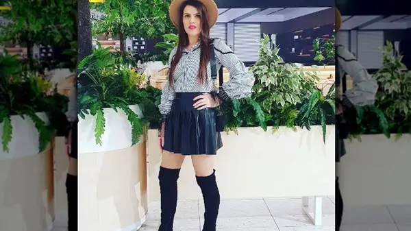 Girl in pleated skirt, button down