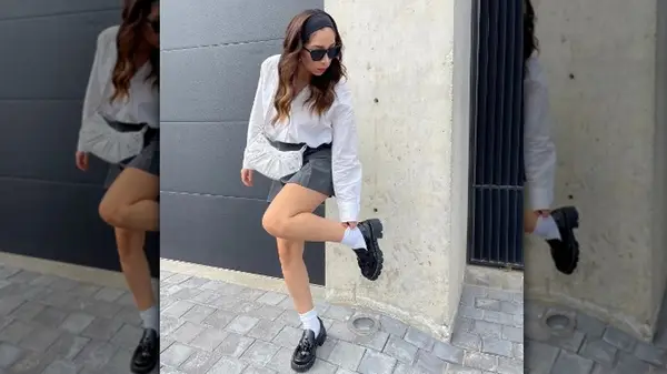 Woman wearing loafers and miniskirt