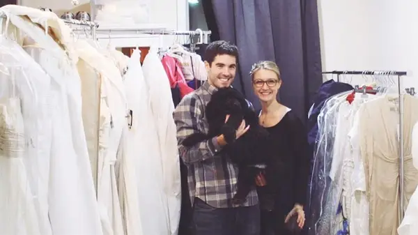 Jackie Courtney and partner with wedding dresses