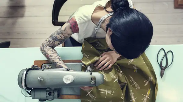 Woman using a sewing machine