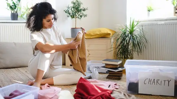 Woman sorts clothes for donation