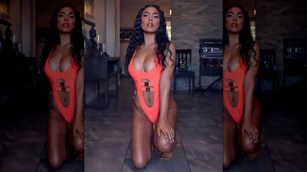 Woman in a swimsuit with hardware