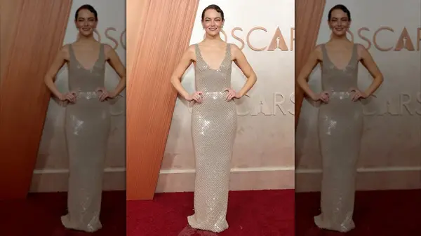 Emma Stone in a cream gown at the 2025 Oscars