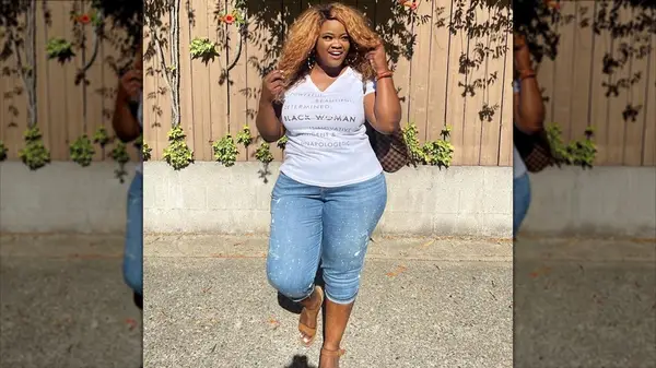 Wearing denim capris