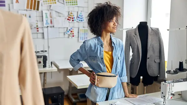 Woman wearing tan belt bag