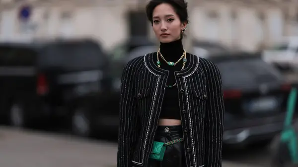 Woman posing with a green fanny pack