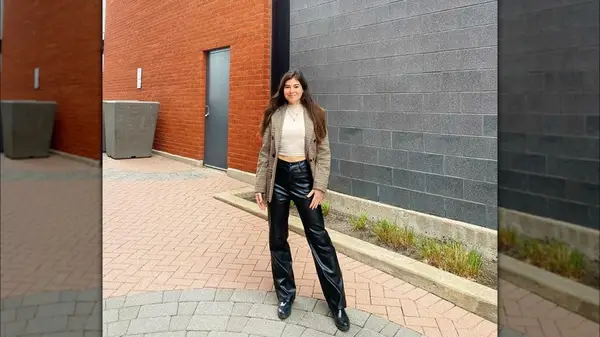 Outfit featuring faux leather pants and patterned blazer over white shirt 