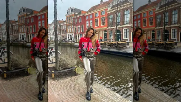 Outfit featuring metallic, vinyl pants and multi-colored sweater