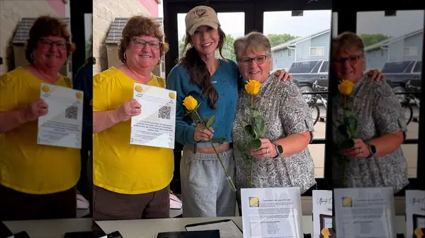 Kristi Noem in athleisure wear posing with two women