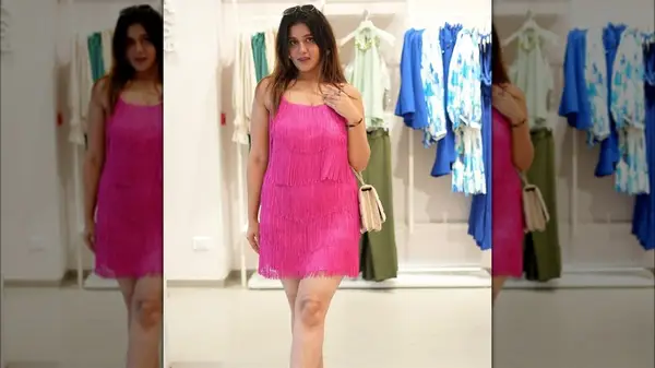 Woman in pink fringe dress