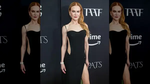 Nicole Kidman at an event in a cutout black dress