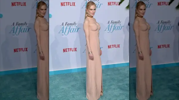 Nicole Kidman in a beige dress at an event