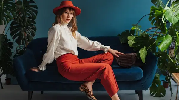 Woman in blood orange pants