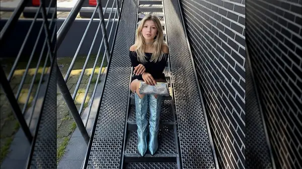 Woman wearing metallic boots