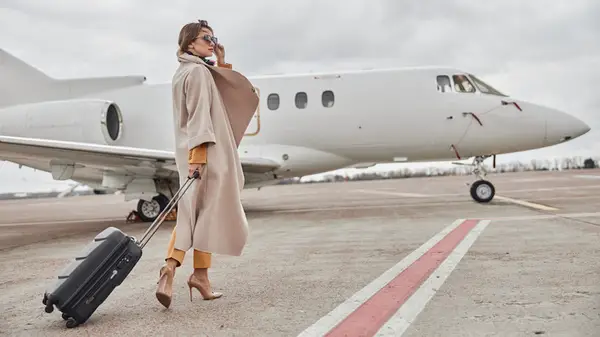 woman in front of airplane