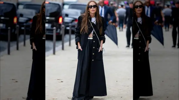 A woman in a long black coat 