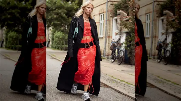 A woman in a long black coat 