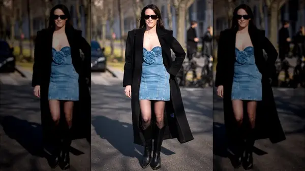 A woman in a long black coat 