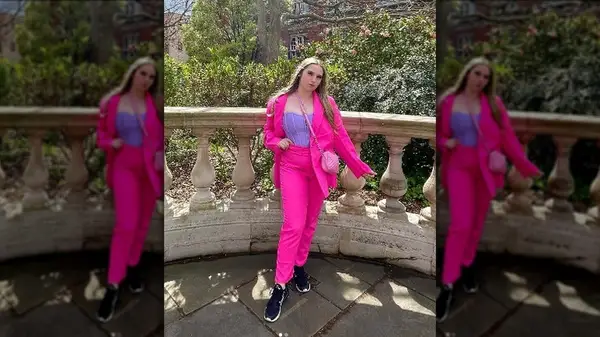 Woman in pink and purple ensemble