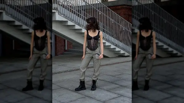 Woman in black corset, cargo pants