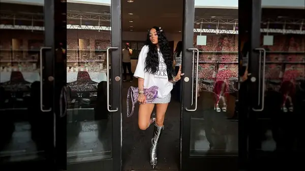 A woman posing in 90s fashion