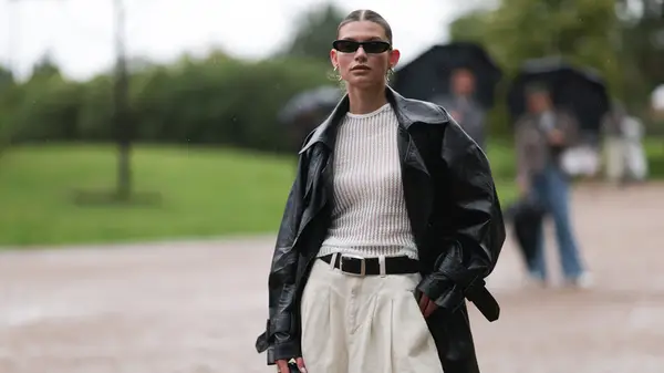 Woman wearing classic black coat