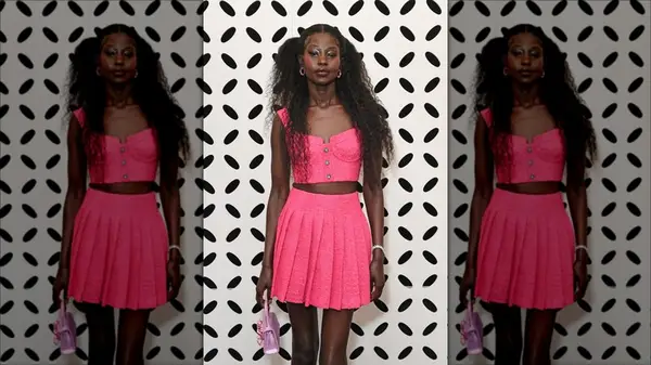 Woman wearing pleated skirt and boots