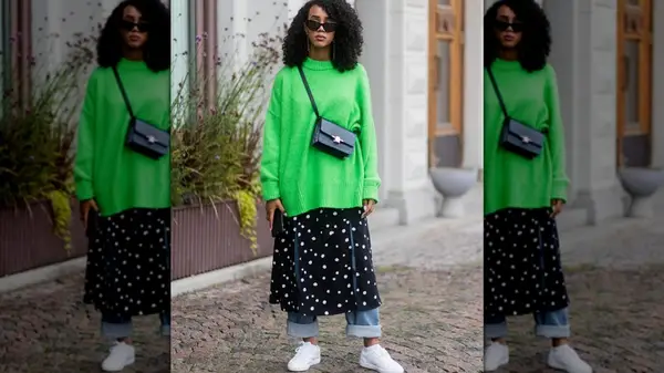 Woman in white sneakers and layered jeans 