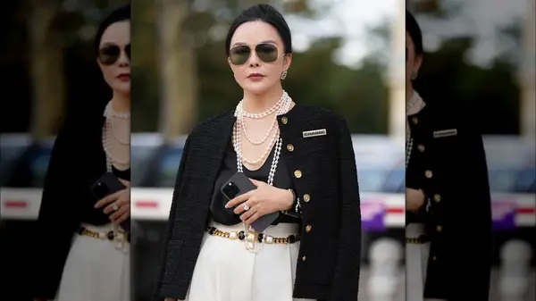 A woman in a boucle jacket 