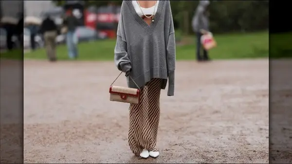 model in silk skirt and large sweater